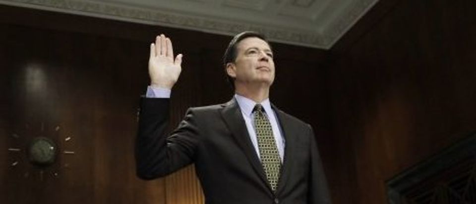 FBI Director Comey is sworn in prior to testifying at a Senate Judiciary Committee hearing on Capitol Hill in Washington