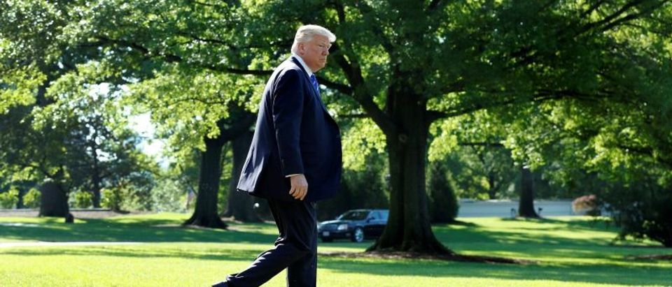 U.S. President Donald Trump walks on the South Lawn of the White House in Washington, DC