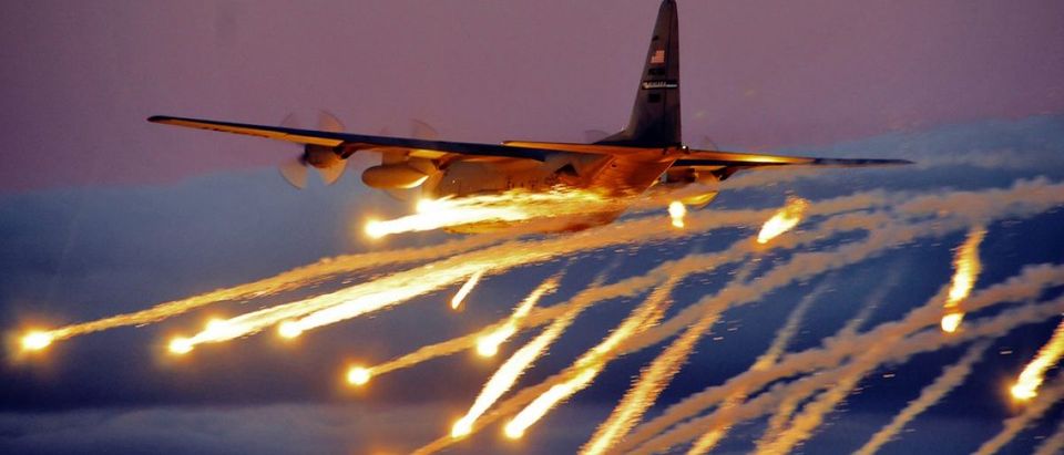 A C-130 from the Niagara Falls Air Reserve Station launches flares over Lake Ontario during a training exercise August 10, 2011, Niagara Falls, NY. Flares can be launched from an aircraft as a defensive measure against hostile forces. (U.S. Air Force photo by Staff Sgt. Joseph McKee)