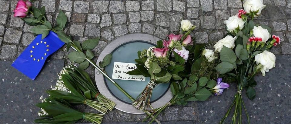 Flowers as a tribute for victims of Monday's suicide bombing at Manchester Arena in the English city of Manchester are seen in front of the British embassy in Berlin, Germany May 23, 2017. REUTERS/Fabrizio Bensch