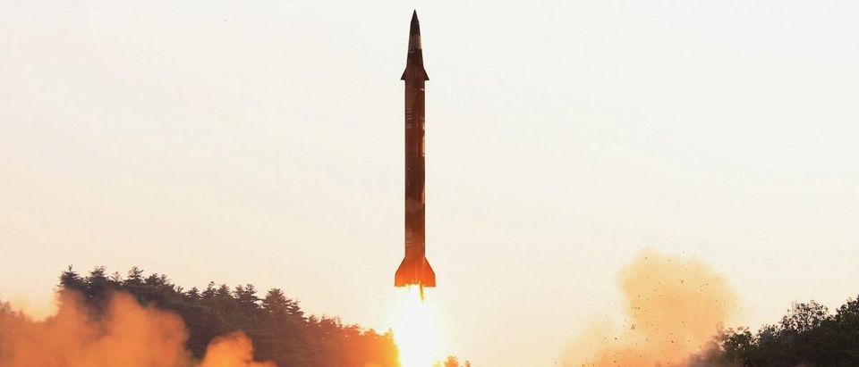 A ballistic rocket is test-fired through a precision control guidance system in this undated photo released by North Korea's Korean Central News Agency