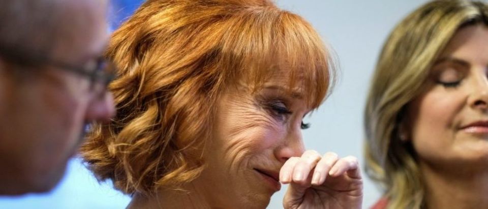 Comedian Kathy Griffin (C) cries during a news conference in Woodland Hills, Los Angeles, California