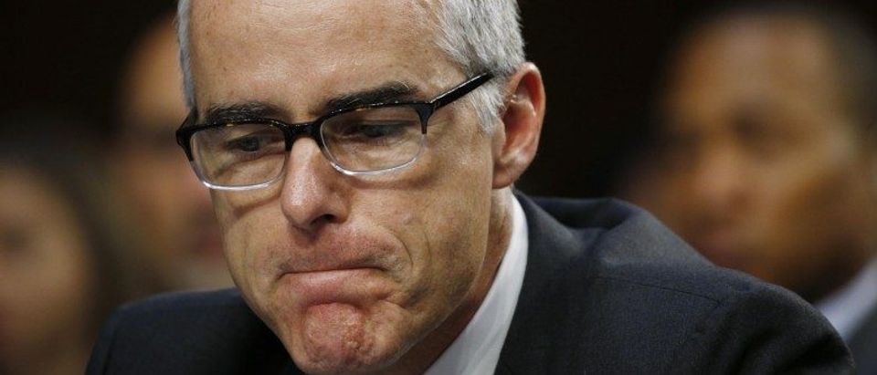 Acting FBI Director McCabe pauses while testifying before a Senate Intelligence Committee hearing on the Foreign Intelligence Surveillance Act on Capitol Hill in Washington