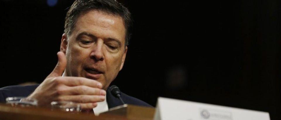 Former FBI Director Comey testifies before a Senate Intelligence Committee hearing in Washington