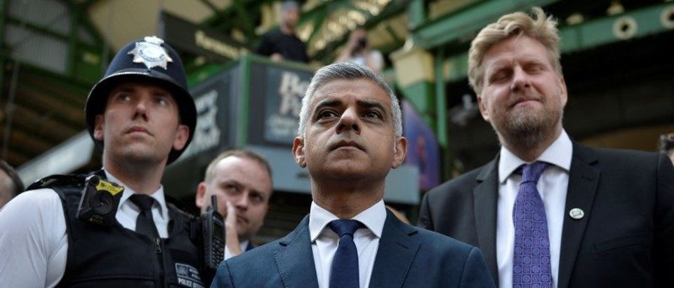 London Mayor Sadiq Khan stands in Borough Market, which officially re-opened today following the recent attack, in central London