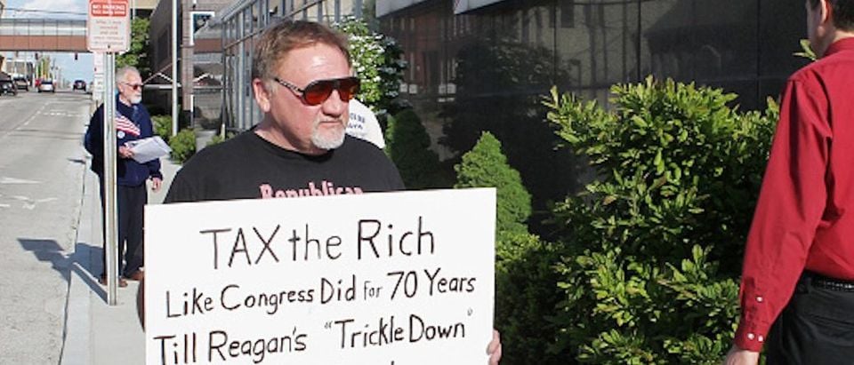 James Hodgkinson of Belleville protests outside of the United States Post Office in Downtown Belleville Tuesday. Hodgkinson is part of the "99%" team drawing attention to the disproportionate amount of money and political power the top 1% of Americans have acquired. Also protesting outside of the post office where members of the Communications Workers of America Local 4217 they were drawing attention to the low percentage of taxes paid by AT&amp;T. (Derik Holtmann/Belleville News-Democrat/TNS via Getty Images)