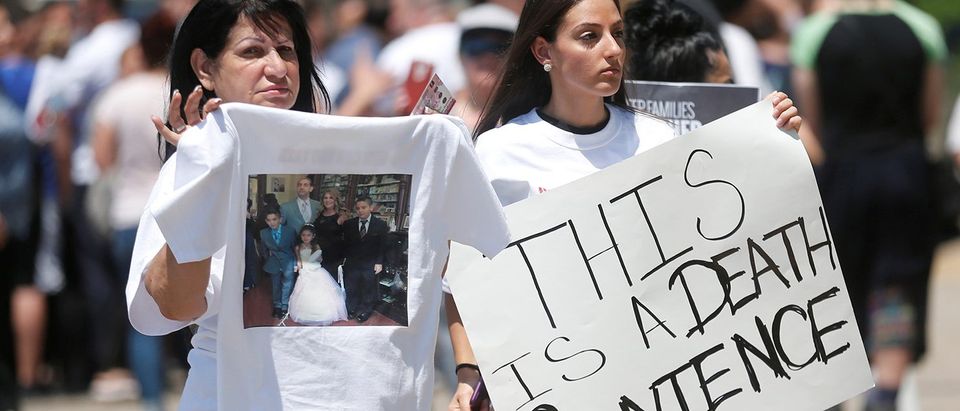 Chaldean-Americans protest against the seizure of family members Sunday by Immigration and Customs Enforcement agents during a rally outside the Mother of God Chaldean church in Southfield