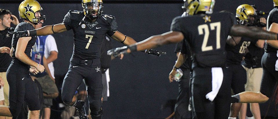 Emmanuel Smith #7 and Jahmel McIntosh #27 of the Vanderbilt Commodores celebrate after a touchdown against the South Carolina Gamecocks during the second half of a game at Vanderbilt Stadium on September 20, 2014 in Nashville, Tennessee. (Photo by Frederick Breedon/Getty Images)