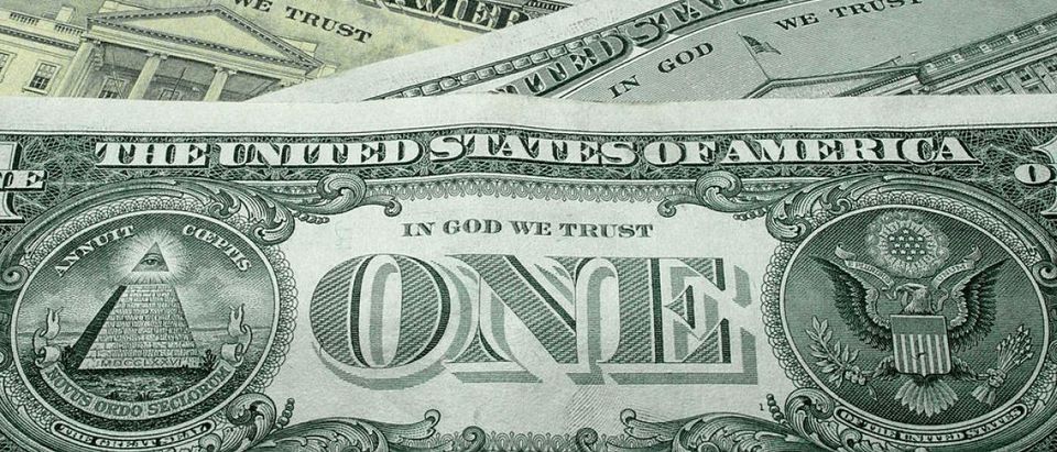 WASHINGTON - OCTOBER 14: The words "In God We Trust" are seen on U.S. currency October 14, 2004 in Washington, DC. Although the U.S. constitution prohibits an official state religion, references to God appear on American money, the U.S. Congress starts its daily session with a prayer, and the same U.S. Supreme Court that has consistently struck down organized prayer in public schools as unconstitutional opens its public sessions by asking for the blessings of God. The Supreme Court will soon use cases from Kentucky and Texas to consider the constitutionality of Ten Commandments displays on government property, addressing a church-state issue that has ignited controversy around the country. (Photo Illustration by Alex Wong/Getty Images)