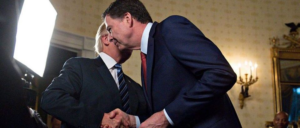Trump shakes hands with Comey in January 2017. Andrew Harrer-Pool/Getty Images.