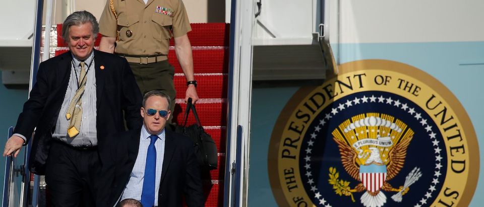 Spicer, Bannon and Miller deplane as they arrive with Trump aboard Air Force One at Joint Base Andrews, Maryland