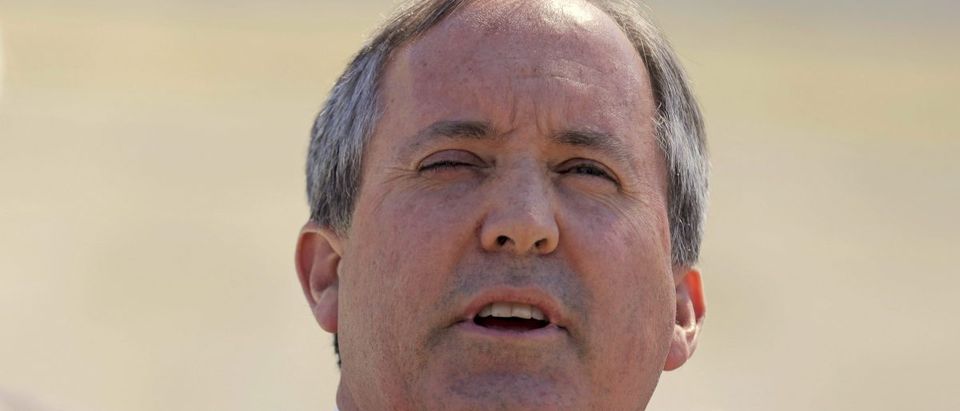 Texas Attorney General Ken Paxton speaks outside the U.S. Supreme Court after justices heard arguments in a challenge by 26 states over the constitutionality of President Barack Obama's executive action to defer deportation of certain immigrant children and parents who are in the country illegally in Washington, D.C., U.S. April 18, 2016. REUTERS/Joshua Roberts/File Photo - RTX2E12Q
