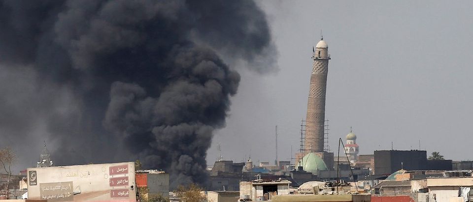 Smoke rises from clashes near Mosul's Al-Habda minaret at the Grand Mosque, where Islamic State leader Abu Bakr al-Baghdadi declared his caliphate back in 2014, as Iraqi forces battle to drive out Islamic state militants from the western part of Mosul