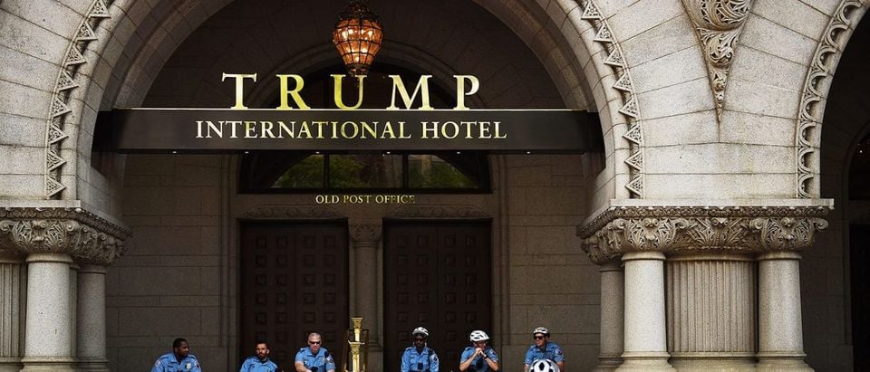 Police officers wait for the marchers in the entrance of the Trump International Hotel which they are assigned to protect during the People's Climate Movement to protest President Donald Trump's enviromental policies April 29, 2017 in Washington, DC. Demonstrators across the country are gathering to demand a clean energy economy. (PHOTO: Astrid Riecken/Getty Images)