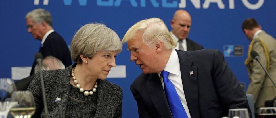 U.S. President Donald Trump (R) speaks to Britain's Prime Minister Theresa May during in a working dinner meeting at the NATO headquarters during a NATO summit of heads of state and government in Brussels, Belgium, May 25, 2017. REUTERS/Matt Dunham/Pool