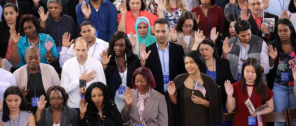Immigrants To U.S. Become Citizens During Naturalization Ceremony On Ellis Island