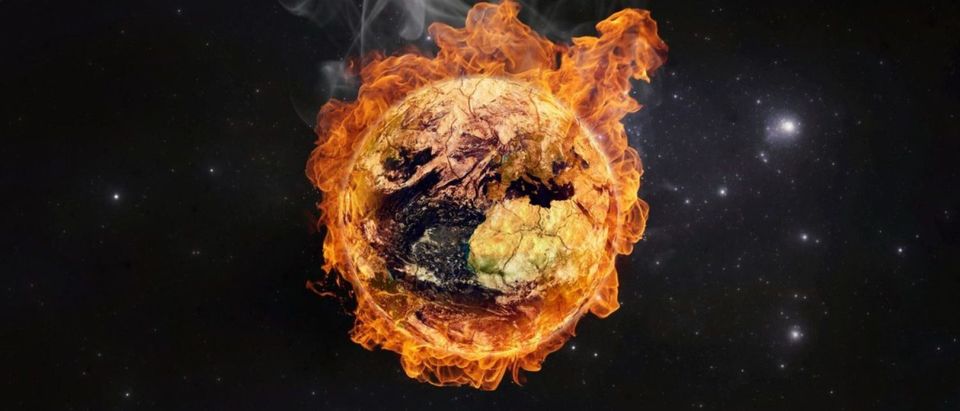 Planet Earth in flames, Global warming concept. Elements of this image furnished by NASA (Shutterstock/Martin Capek)