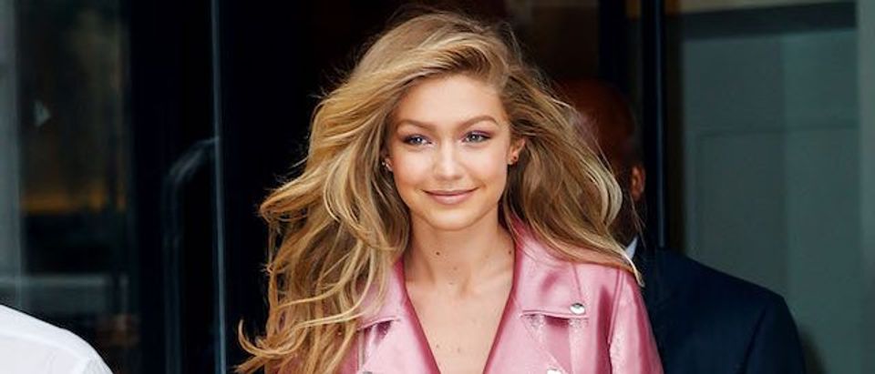 Gigi Hadid wears a dazzling pink outfit for the launch of her Vogue Eyewear line in New York
