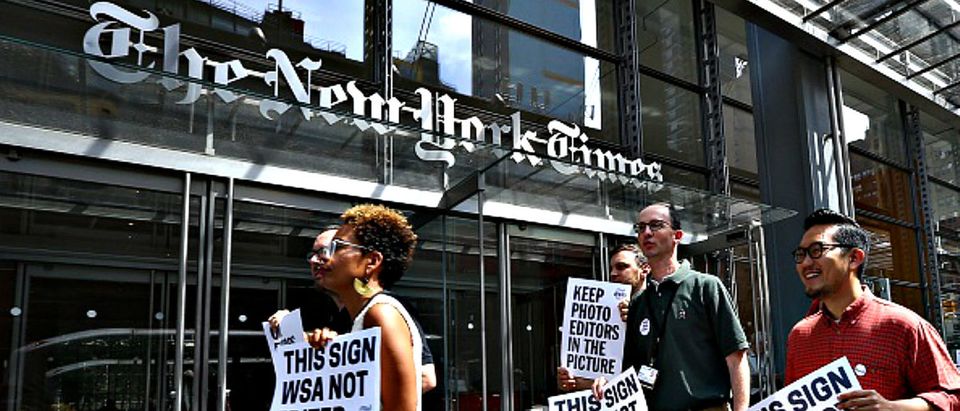 NEW YORK, USA - JUNE 29 : New York Times (NYT) employees hold banners during a temporary strike against downsizing and dismissal plans of the NYT management outside of New York Times building in New York, United States on June 29, 2017. (Photo by Volkan Furuncu/Anadolu Agency/Getty Images) Restrictions