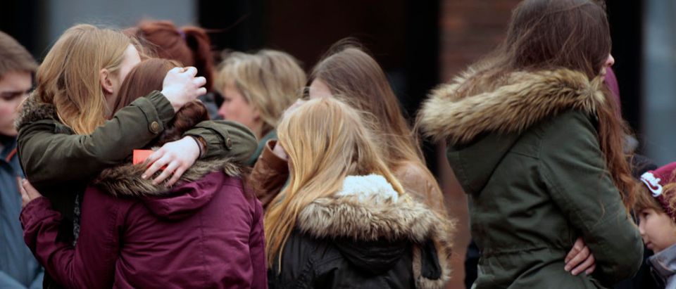 Students hug each other after a memorial service at St. Sixtus church in Haltern am See, March, 27, 2015. Some 16 students and two teachers from Josef-Koenig-Gymnasium high school in Haltern am See, were on board the ill-fated Germanwings flight 4U9525 that crashed in a remote snowy area of the French Alps on Tuesday on its way home to Duesseldorf. REUTERS/Ina Fassbender