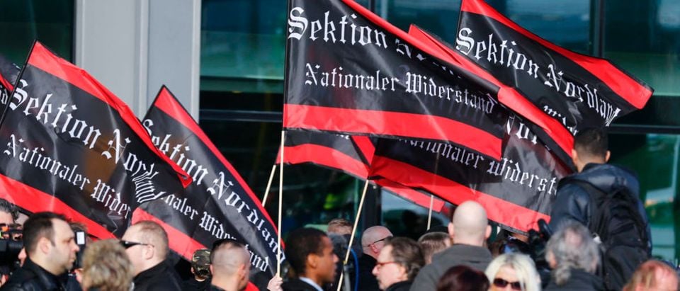 Ultra right-wing protesters carry flags through Berlin