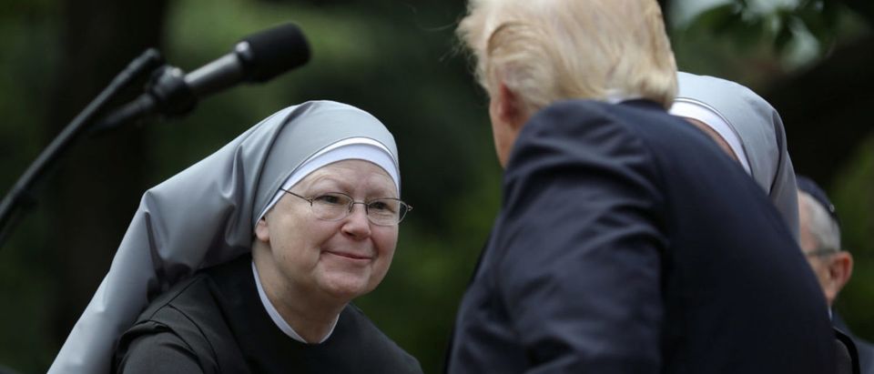 U.S. President Donald Trump shakes hands with a nun of the Little Sisters of The Poor during a National Day of Prayer event at the Rose Garden of the White House in Washington D.C., U.S., May 4, 2017. (Photo: REUTERS/Carlos Barria)