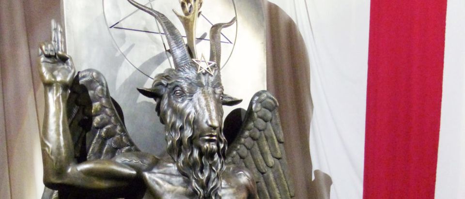 A one-ton, 7-foot (2.13-m) bronze statue of Baphomet -- a goat-headed winged deity that has been associated with satanism and the occult -- is displayed by the Satanic Temple during its opening in Salem, Massachusetts, U.S. September 22, 2016. (Photo: REUTERS/Ted Siefer)