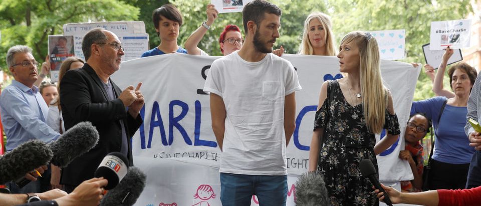 The parents of critically ill baby Charlie Gard, Connie Yates and Chris Gard, speak to supporters and the media before handing in a petition to Great Ormond Street Hospital, in central London, Britain July 9, 2017. The parents want their son, who has a form of mitochondrial disease, to be able to travel to receive further treatment, after losing a long legal battle to give him experimental therapy in the United States. REUTERS/Peter Nicholls - RTX3AQ2Y