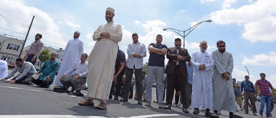 Shutterstock/ NEW YORK CITY - AUGUST 15 2016: The Muslim community held a memorial service for slain Imam Maulano Akojee & Thara Uddin in East New York followed by a march to Ozone Park, Queens muslimimamfuneralaffairsakojeeassassinationbrooklynbureaucityclergycommunityconcerndefamationdemonstrationeasteldereulogyfearislamleadersmarchmaulanomemorialminoritymurdernewnypdofficialsoutreachozoneparkprayerqueensrallyreligionsermonsignstharauddinvenerableviolenceyorkShow more