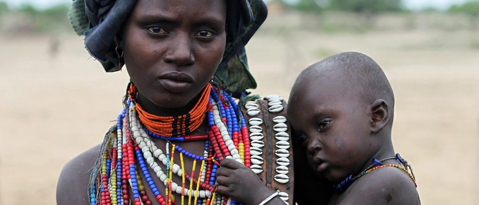 Shutterstock/ SOUTH ETHIOPIA, AFRICA - DEC 27, 2009 Unidentified Mother and her son - Arbore tribe