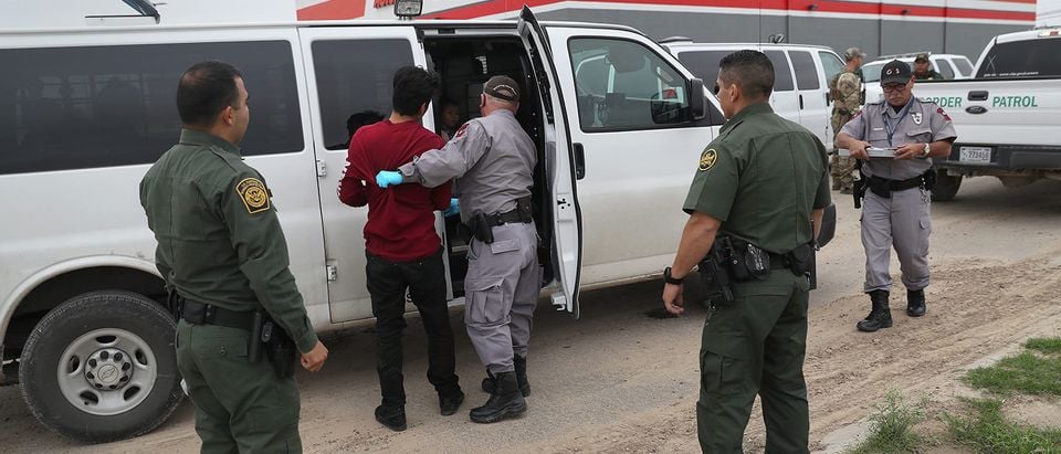 U.S. border officials detain an undocumented immigrant caught near the U.S.-Mexico border on March 13, 2017 in Roma, Texas. The Border Patrol has reported that illegal crossings from Mexico have dropped some 40 percent along the southwest border since Donald Trump took office. (Photo by John Moore/Getty Images)