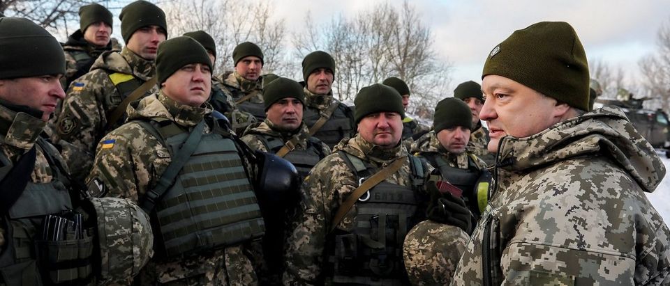 Ukrainian President Poroshenko meets with servicemen during visit to defence post located on troops contact line with Russian-backed separatists in eastern Ukraine near Gorlivka
