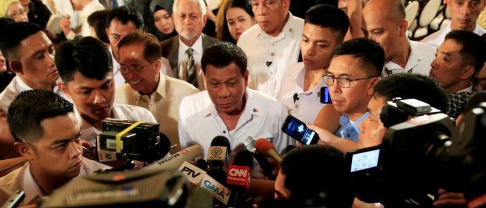 FILE PHOTO - Philippine President Rodrigo Duterte is interviewed by reporters after the handover of a draft law of the Bangsamoro Basic Law (BBL) in a ceremony at the Malacanang presidential palace in metro Manila, Philippines July 17, 2017. REUTERS/Romeo Ranoco/File Photo