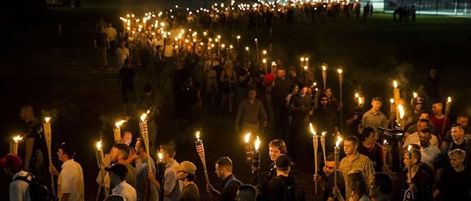 CHARLOTTESVILLE, USA - AUGUST 11: Neo Nazis, Alt-Right, and White Supremacists march through the University of Virginia Campus with torches in Charlottesville, Va., USA on August 11, 2017. (Photo by Samuel Corum/Anadolu Agency/Getty Images)