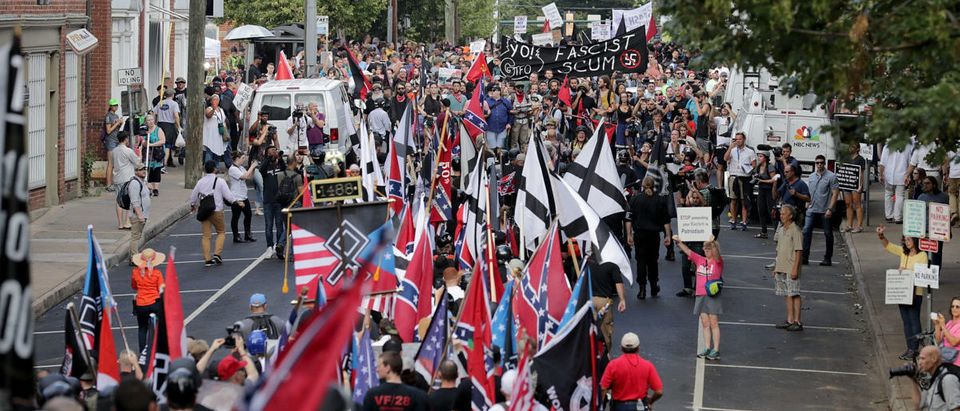 CHARLOTTESVILLE, VA - AUGUST 12: Hundreds of white nationalists, neo-Nazis and members of the "alt-right" march down East Market Street toward Lee Park during the "Unite the Right" rally August 12, 2017 in Charlottesville, Virginia. After clashes with anti-fascist protesters and police the rally was declared an unlawful gathering and people were forced out of Lee Park, where a statue of Confederate General Robert E. Lee is slated to be removed. (Photo by Chip Somodevilla/Getty Images)