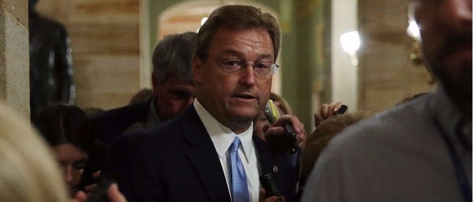 Sen. Dean Heller (R-NV) is surround by members of the media. (Alex Wong/Getty Images)