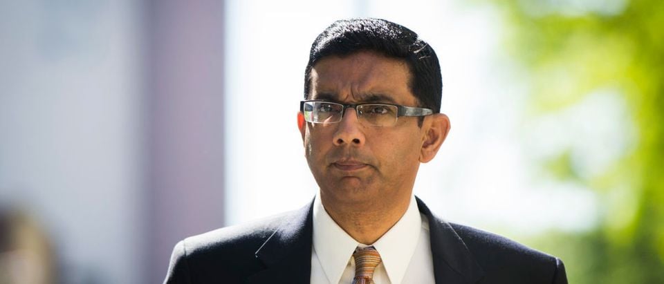 Dinesh D'Souza exits the Manhattan Federal Courthouse after pleading guilty in New York, May 20, 2014. REUTERS/Lucas Jackson