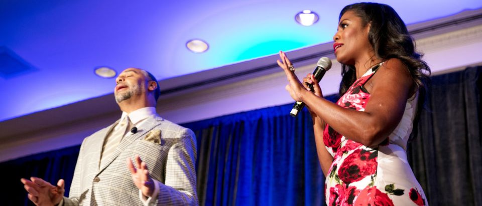 White House aide Omarosa Manigault (L) speaks as panel moderator Edward Gordon reacts during a panel discussion at the National Association of Black Journalists convention in New Orleans, Louisiana, U.S. August 11, 2017. REUTERS/Omar Negrin