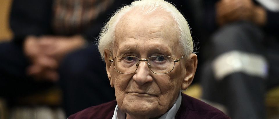 Oskar Groening, defendant and former Nazi SS officer dubbed the "bookkeeper of Auschwitz", sits in the courtroom during his trial in Lueneburg, Germany, July 15, 2015. The 94-year-old German man who worked as a bookkeeper at the Auschwitz death camp was convicted on Wednesday of being an accessory to the murder of 300,000 people and was sentenced to four years in prison, in what could be one of the last big Holocaust trials. REUTERS/Axel Heimken/Pool - RTX1KBTU
