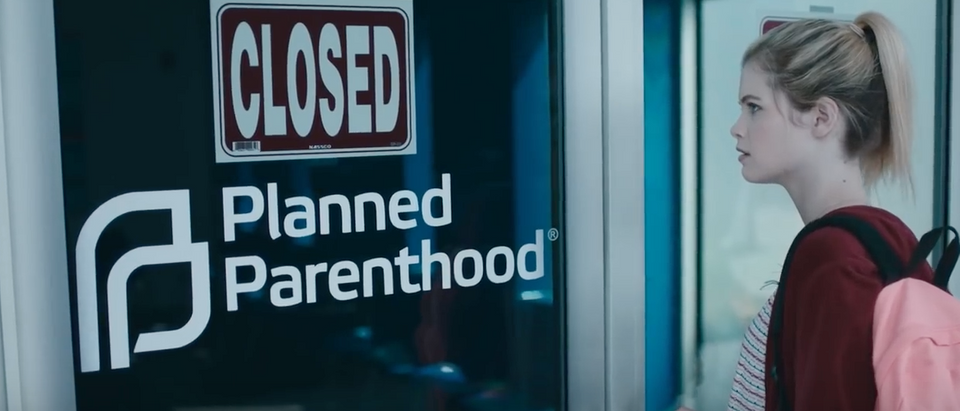 A girl looks at a closed abortion clinic. (Photo: Youtube screenshot/Joss Whedon)
