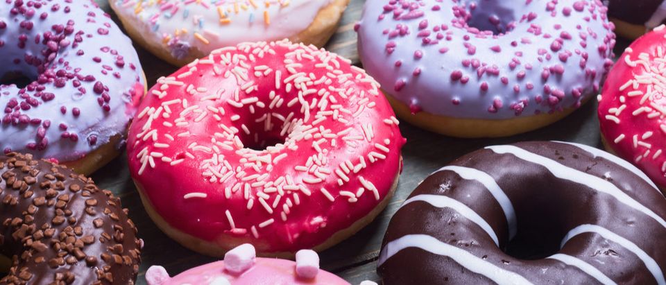 Shutterstock/ assorted donuts with chocolate frosted, pink glazed and sprinkles donuts. donutdoughnutbakedchocolatesugarassortedbackgroundbakerybreakfastcakecolorfuldeliciousdessertdoughfoodfrostedfrostingglazedicingpastrypinkroundsnackspacesprinklesstickysweettabletastytreatunhealthywoodenShow more
