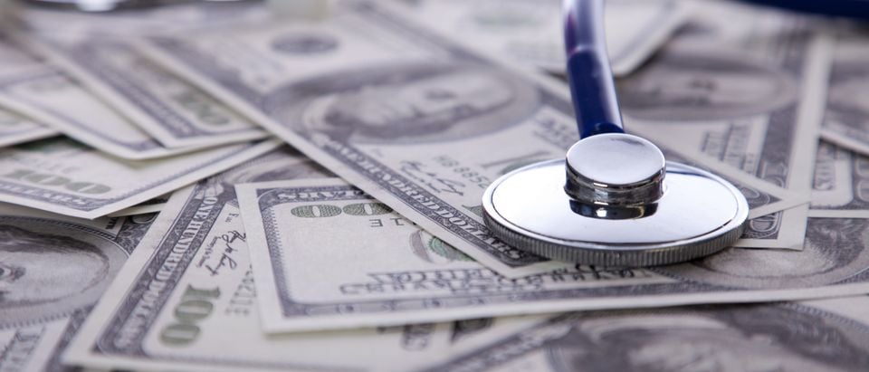 Health care- stethoscope on a pile of money (Photo: Shutterstock/By Helder Almeida)