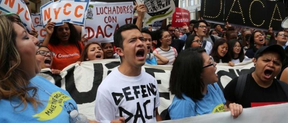 FILE PHOTO: People march and chant slogans against U.S. President Donald Trump's proposed end of the DACA program that protects immigrant children from deportation at a protest in New York City