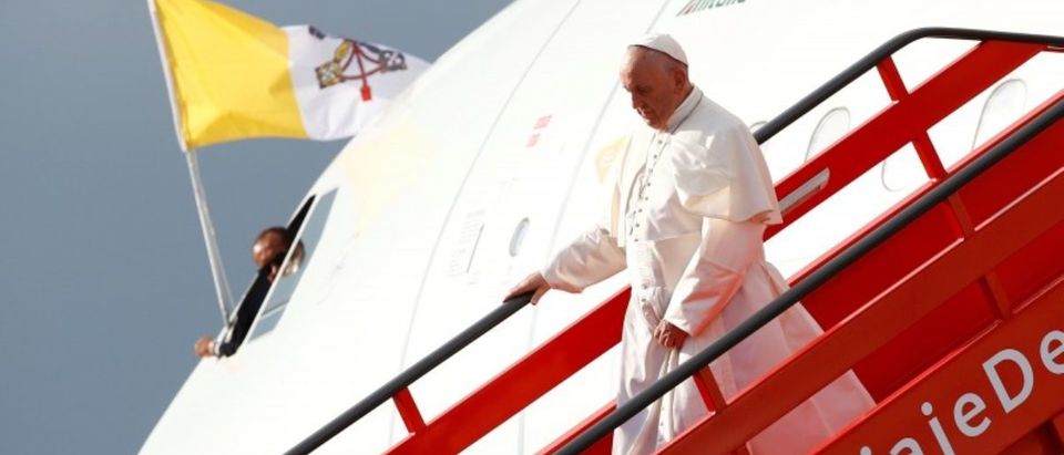 Pope Francis disembarks from the plane after arriving at Bogota
