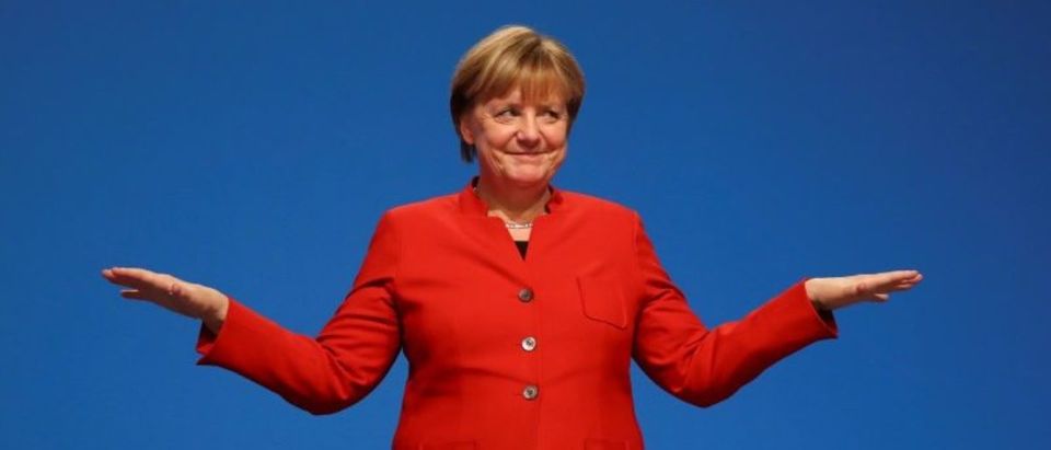 German Chancellor and leader of the conservative CDU Merkel reacts after her speech at the CDU party convention in Essen