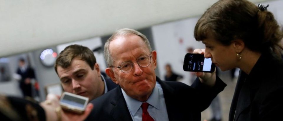 Sen. Lamar Alexander (R-TN) speaks with reporters ahead of the party luncheons on Capitol Hill in Washington