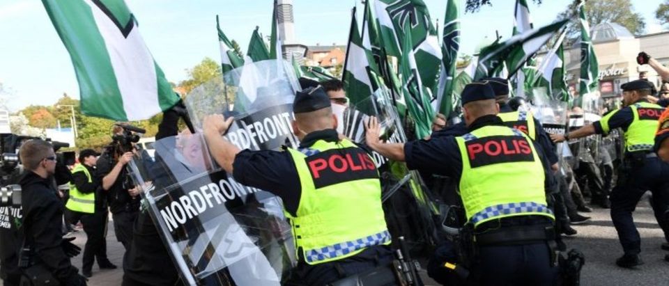 Police officers stop NMR demonstrators from trying to walk along a forbidden street during the Nordic Resistance Movement (NMR) march in central Gothenburg, Sweden September 30, 2017. Fredrik Sandberg/TT News Agency/via REUTERS