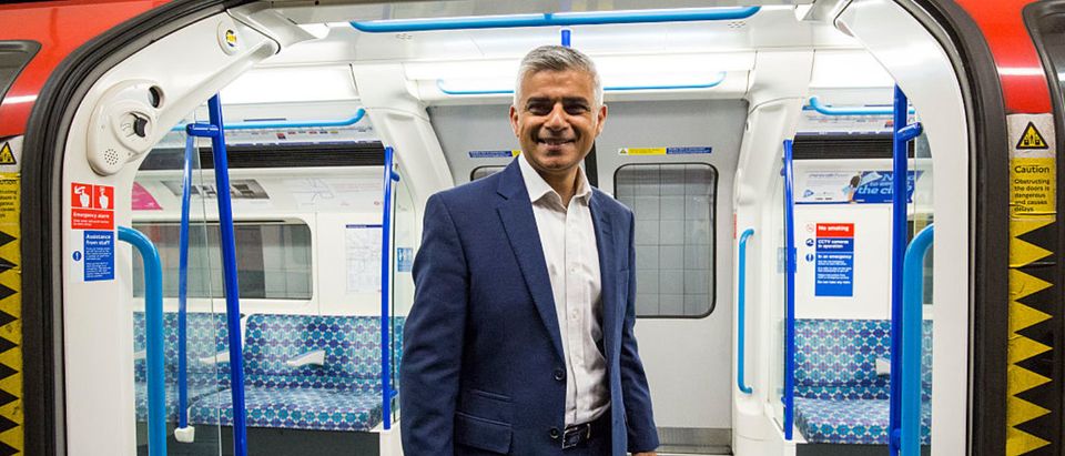 LONDON, ENGLAND - AUGUST 20: London Mayor Sadiq Khan poses in front of the open doors of a train car during the first Night Tube train to leave from Brixton Underground Station on August 20, 2016 in London, England. (Photo by Jack Taylor/Getty Images)