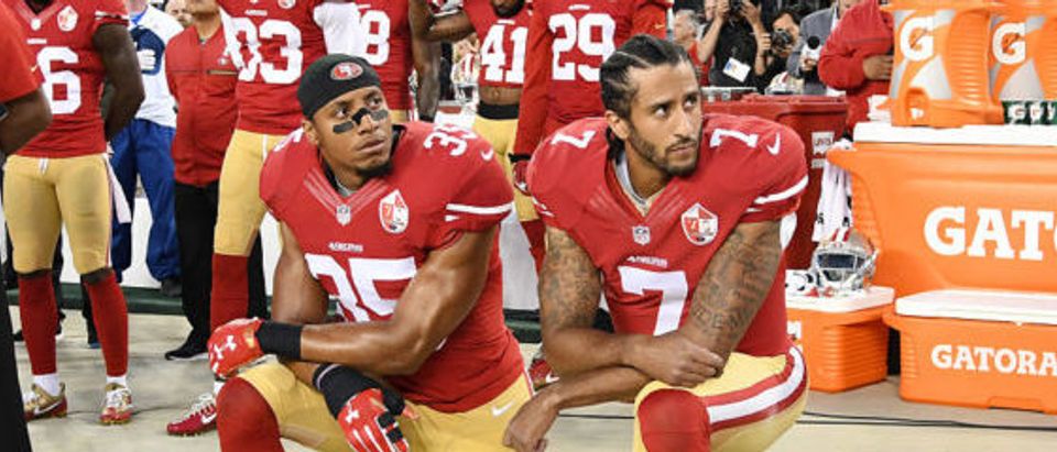 Colin Kaepernick #7 and Eric Reid #35 of the San Francisco 49ers kneel in protest during the national anthem prior to playing the Los Angeles Rams in their NFL game at Levi's Stadium on September 12, 2016 in Santa Clara, California. (Photo by Thearon W. Henderson/Getty Images)
