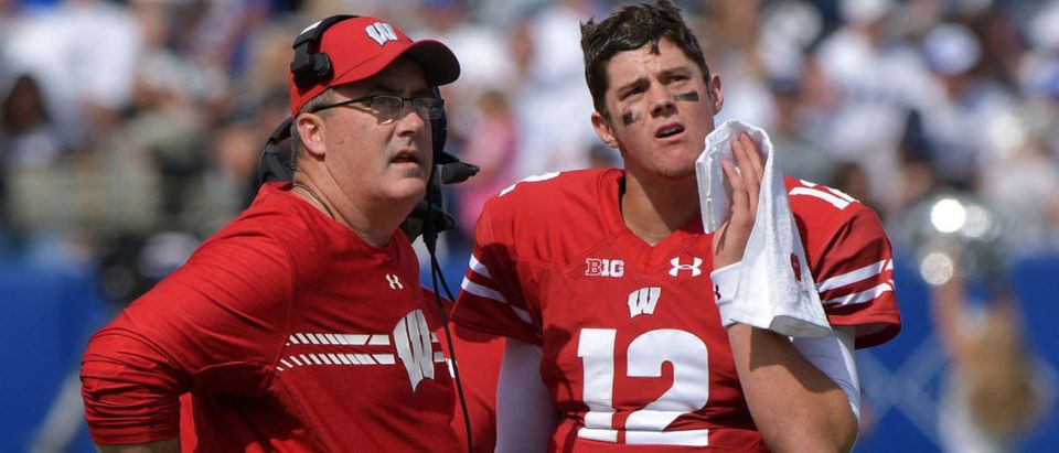 Head coach Paul Chryst of the Wisconsin Badgers and his quarterback Alex Hornibrook #12 look at a replay during a game against the BYU Cougars at LaVell Edwards Stadium on September 16, 2017 in Provo, Utah. (Photo by Gene Sweeney Jr/Getty Images)